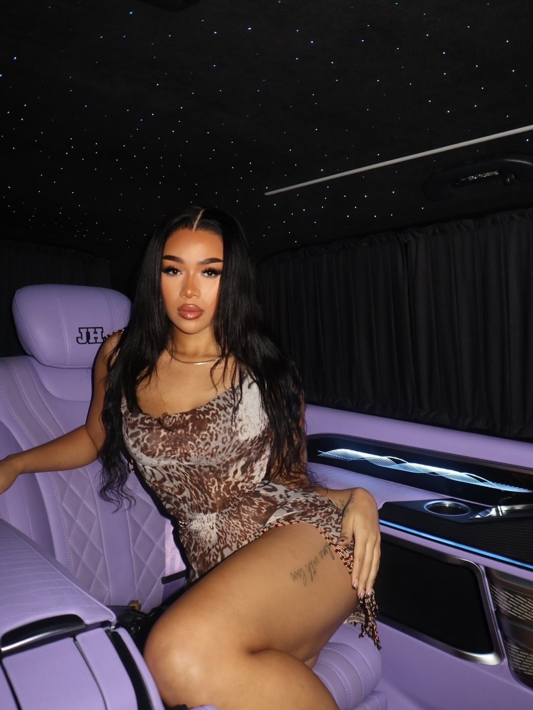 A guest relaxing inside a BYJH vehicle